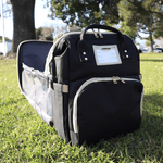 Nursery Bag - Black Convertible Diaper Bag Backpack Expanded on Grass